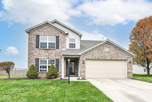 view of front of house featuring a garage and a front yard