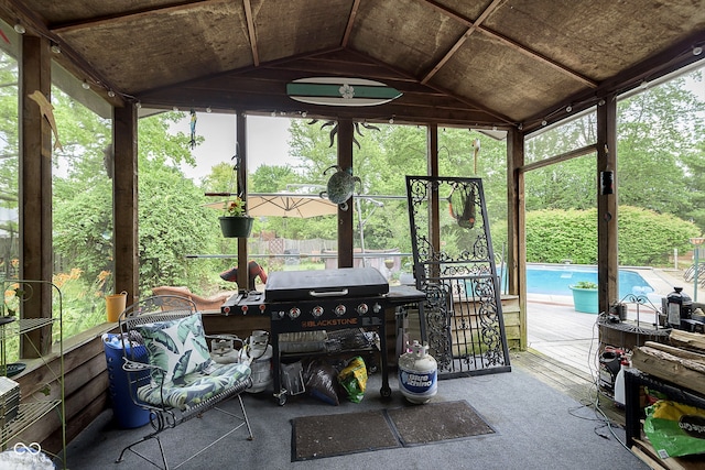 sunroom / solarium with vaulted ceiling