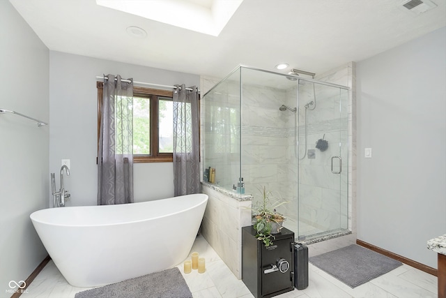 bathroom featuring shower with separate bathtub