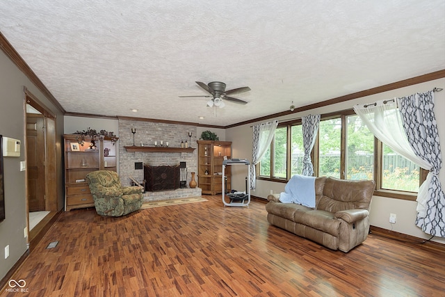 living room featuring hardwood / wood-style floors, ceiling fan, and a textured ceiling