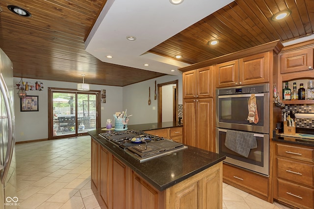 kitchen featuring dark stone countertops, a kitchen island, wooden ceiling, and appliances with stainless steel finishes