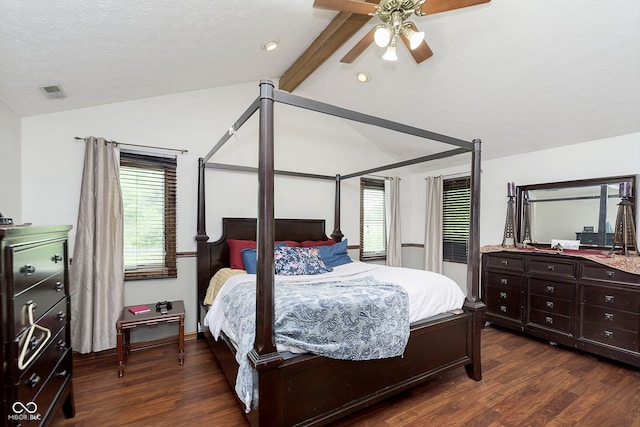 bedroom featuring vaulted ceiling with beams, ceiling fan, dark hardwood / wood-style flooring, and a textured ceiling