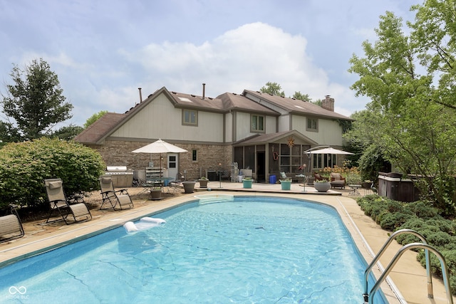 view of swimming pool with a patio area