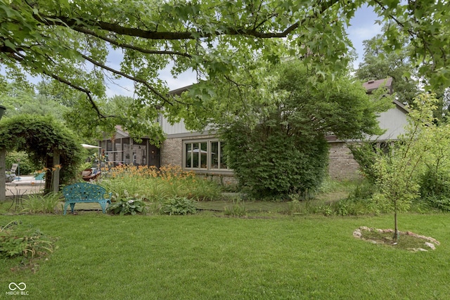 view of yard featuring a sunroom