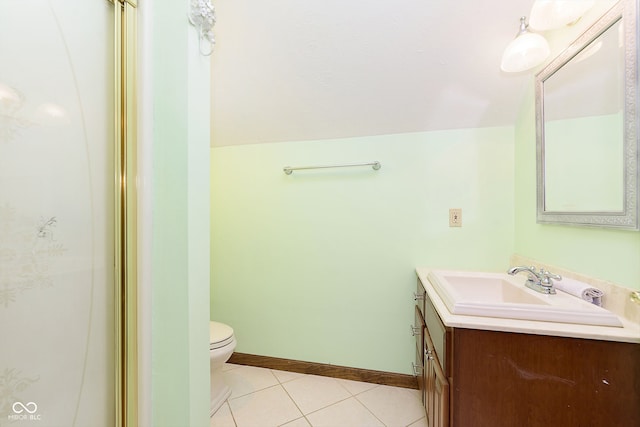 bathroom featuring tile patterned floors, vanity, toilet, and walk in shower