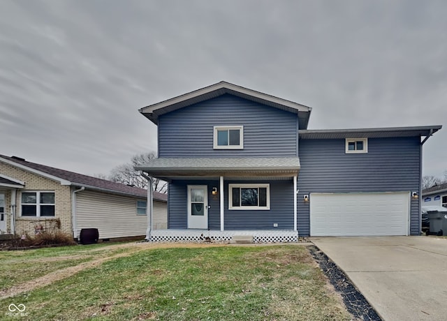 front of property featuring a garage, a porch, and a front yard