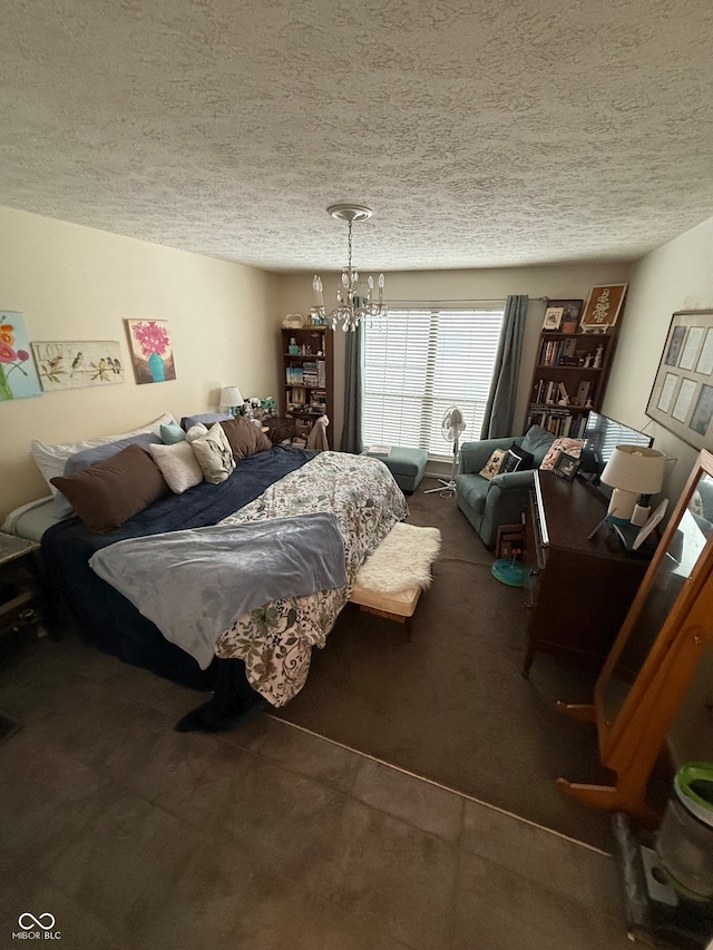 bedroom featuring a textured ceiling, carpet floors, and a notable chandelier