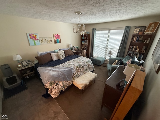 bedroom featuring a textured ceiling and a notable chandelier