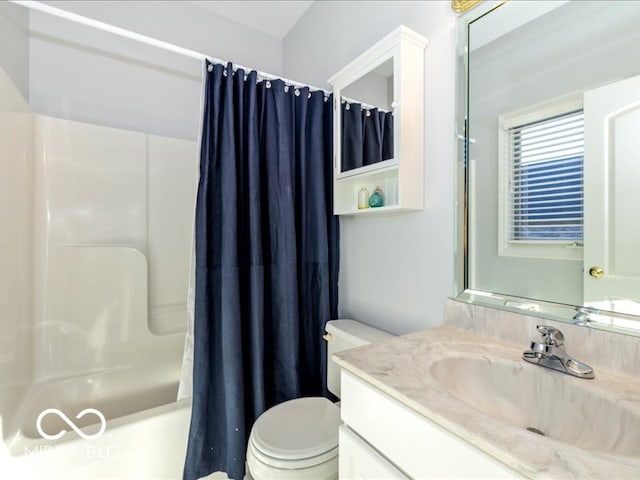 full bathroom featuring vanity, shower / tub combo, and toilet