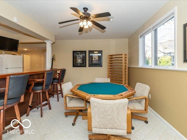 12954 Water Ridge Dr, Fishers, IN 46055 - rec room with ornate columns, a ceiling fan, carpet flooring, and an office area