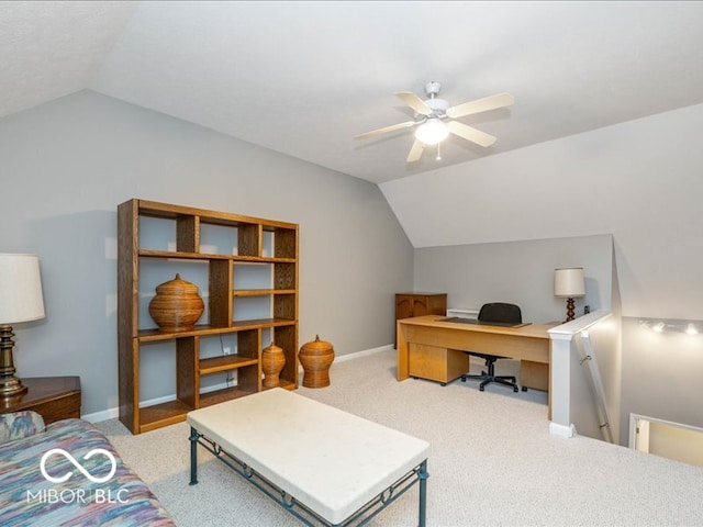 carpeted office space featuring ceiling fan and lofted ceiling