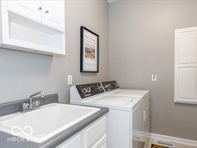 12954 Water Ridge Dr, Fishers, IN 46055 - laundry room with cabinet space and washer and dryer