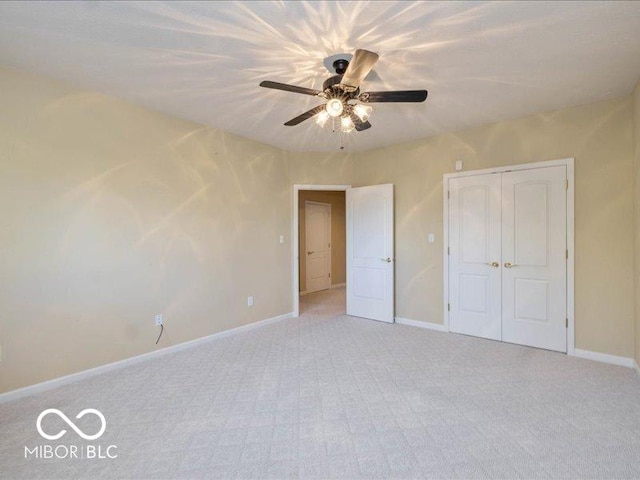 12954 Water Ridge Dr, Fishers, IN 46055 - unfurnished bedroom featuring light colored carpet, baseboards, a closet, and a ceiling fan