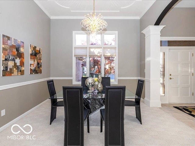 12954 Water Ridge Dr, Fishers, IN 46055 - carpeted dining room featuring decorative columns, a chandelier, plenty of natural light, baseboards, and ornamental molding