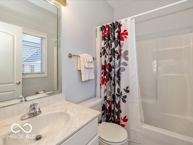 full bathroom featuring shower / bath combo with shower curtain, vanity, and toilet