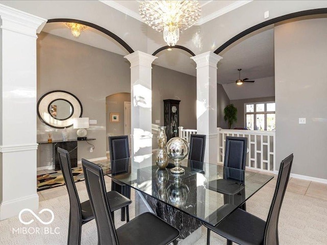 12954 Water Ridge Dr, Fishers, IN 46055 - dining area featuring arched walkways, ornate columns, ceiling fan, vaulted ceiling, and baseboards