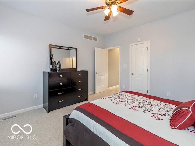 bedroom featuring light carpet and ceiling fan