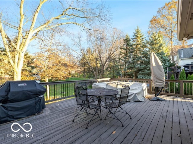 wooden deck featuring grilling area