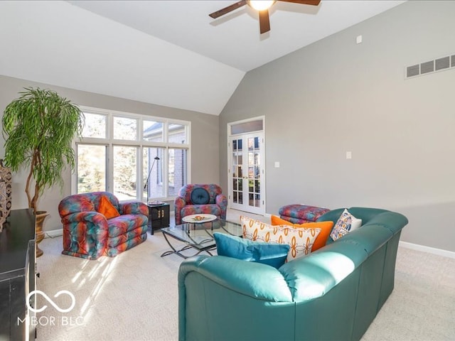 living room featuring carpet flooring, ceiling fan, and lofted ceiling