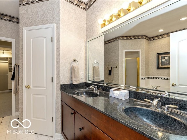 bathroom with tile patterned flooring, vanity, and a shower with shower door