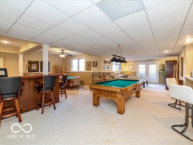 12954 Water Ridge Dr, Fishers, IN 46055 - playroom with light carpet, decorative columns, billiards, a bar, and a drop ceiling