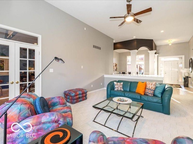 12954 Water Ridge Dr, Fishers, IN 46055 - living area with decorative columns, carpet flooring, ceiling fan, and french doors