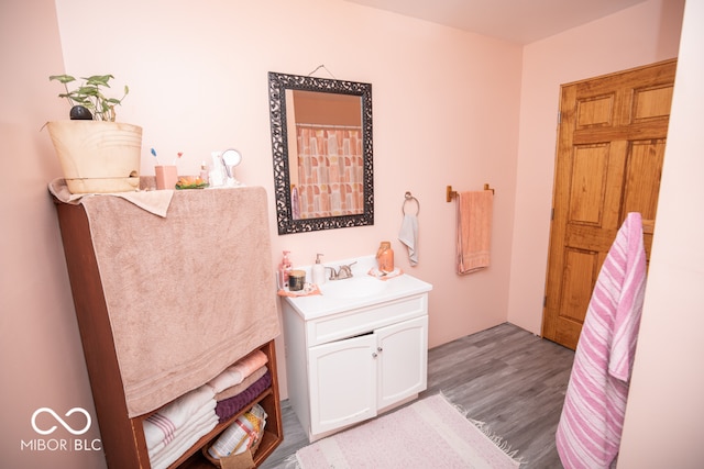 bathroom featuring vanity and hardwood / wood-style flooring