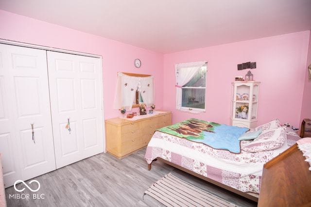 bedroom featuring a closet and light hardwood / wood-style flooring