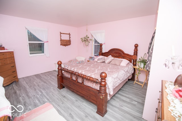 bedroom with light hardwood / wood-style floors