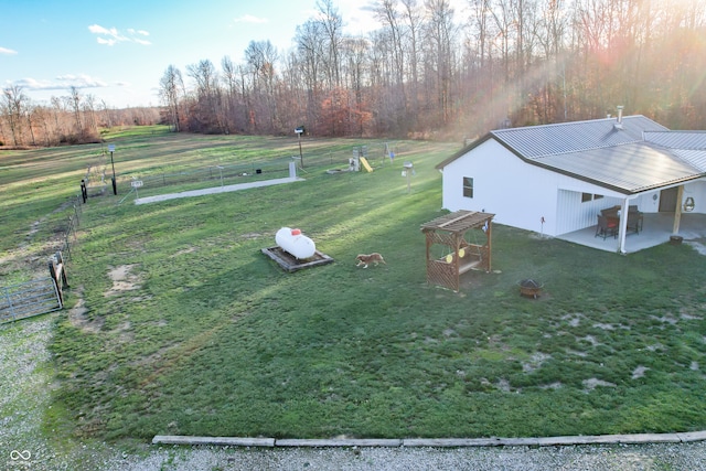 exterior space with a patio area and a rural view