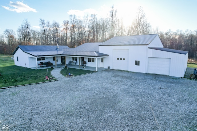 view of front of house with a garage and a front lawn