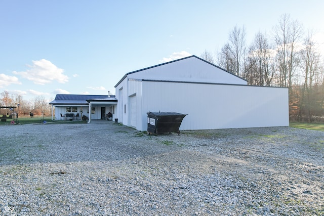 view of outdoor structure featuring solar panels