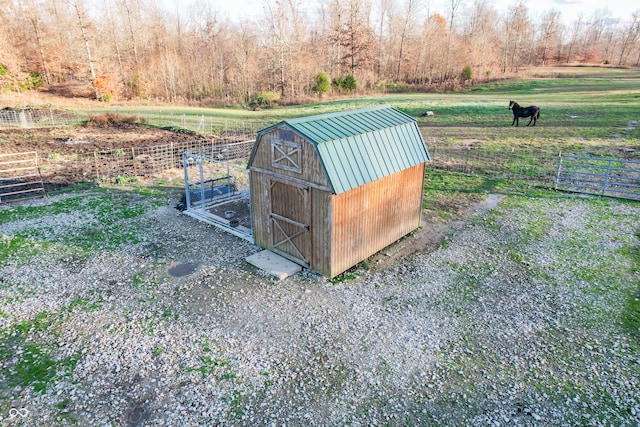 view of outdoor structure with a rural view