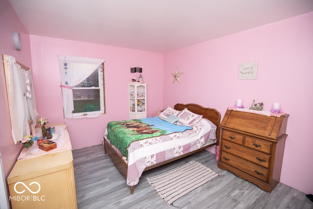 bedroom featuring hardwood / wood-style flooring