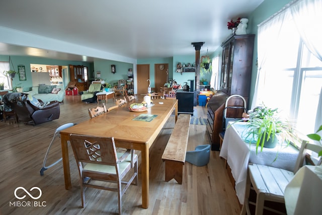 dining area featuring light hardwood / wood-style flooring and a healthy amount of sunlight