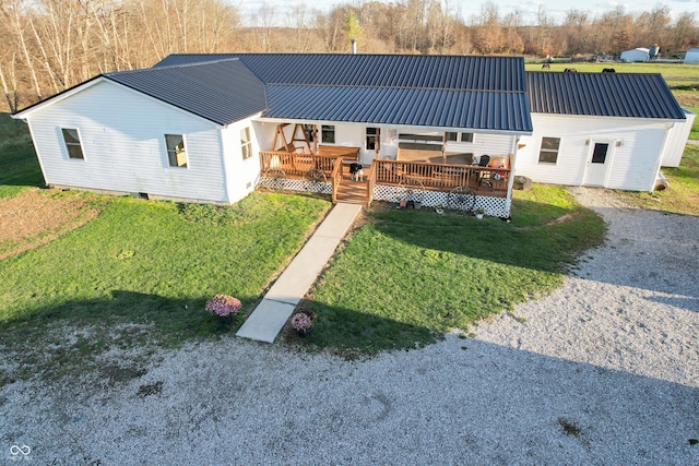 6255 E County Road 850 N, North Vernon, IN 47265 - view of front of home featuring a metal roof, a front lawn, and a wooden deck