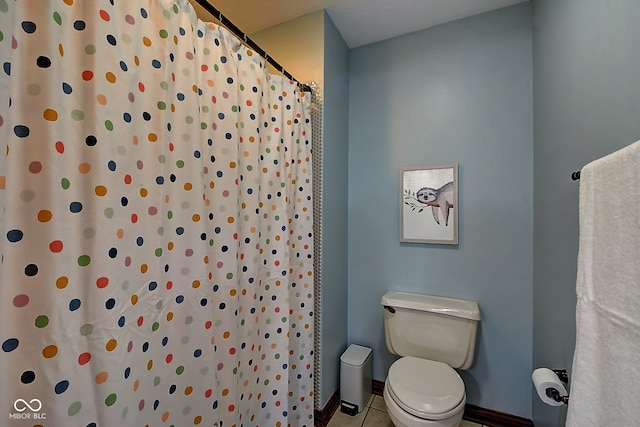 bathroom with tile patterned flooring and toilet