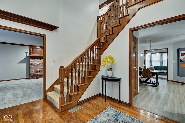 stairway featuring hardwood / wood-style floors