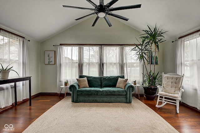 living room featuring ceiling fan, dark hardwood / wood-style flooring, and lofted ceiling