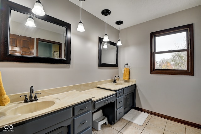 bathroom featuring tile patterned flooring and vanity