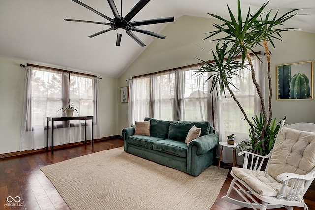 living room with dark wood-type flooring, ceiling fan, and lofted ceiling