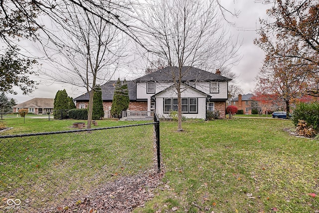 view of front of property featuring a sunroom and a front yard