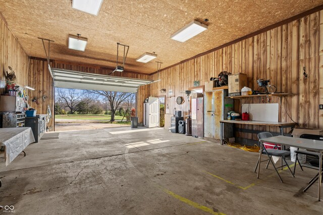 garage featuring wood walls