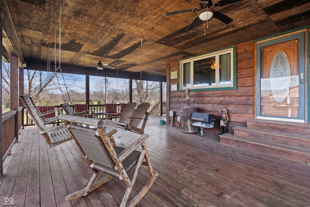 deck featuring outdoor dining space, entry steps, and a ceiling fan