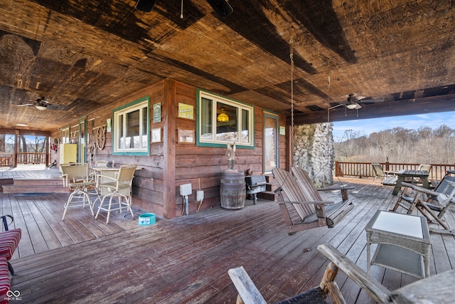 wooden terrace featuring ceiling fan