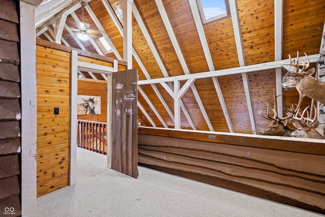 interior space featuring an upstairs landing and a skylight