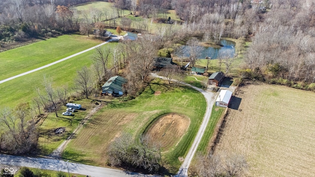 birds eye view of property with a rural view