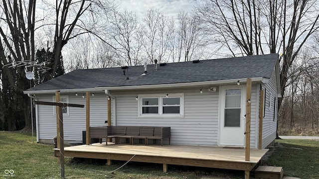 back of property featuring outdoor lounge area, a deck, and a yard