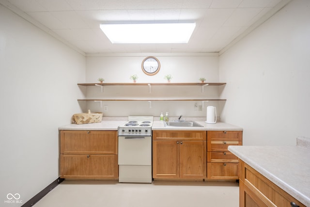 kitchen featuring sink and white range