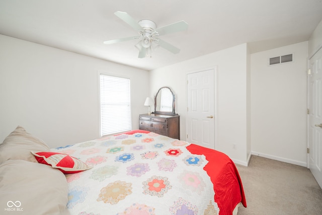 bedroom featuring ceiling fan and light carpet